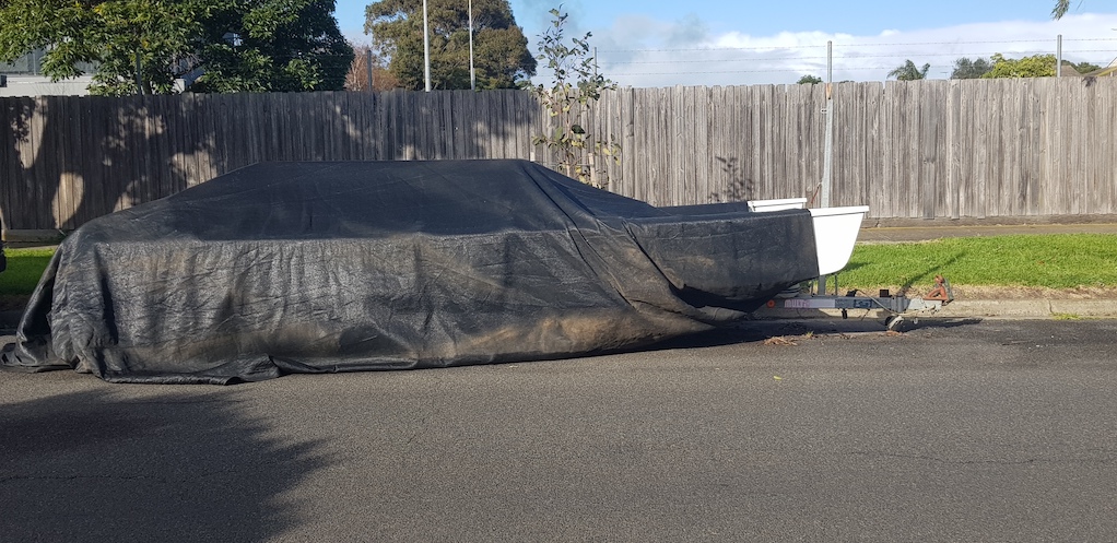 Boat parked on road