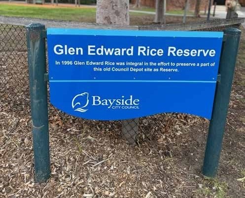 Signage: Glen Edward Rice Reserve.  In 1996 Glen Edward Rice was integral in the effort to preserve a part of this old Council Depot site as Reserve.  Bayside City Council